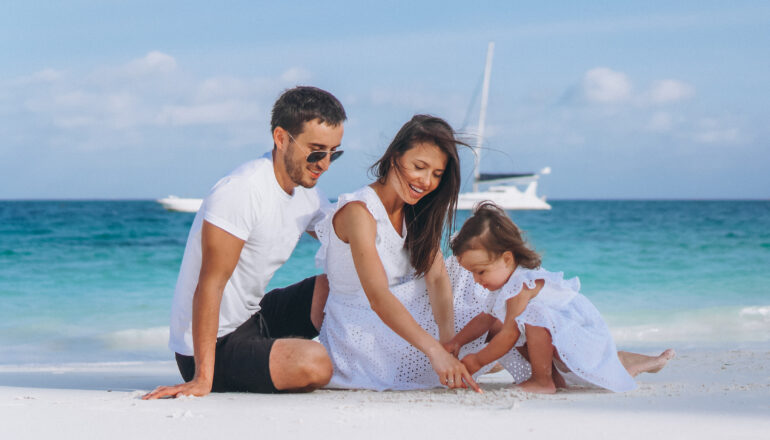 Happy family enjoying one of the best places to travel with family, smiling together outdoors on vacation